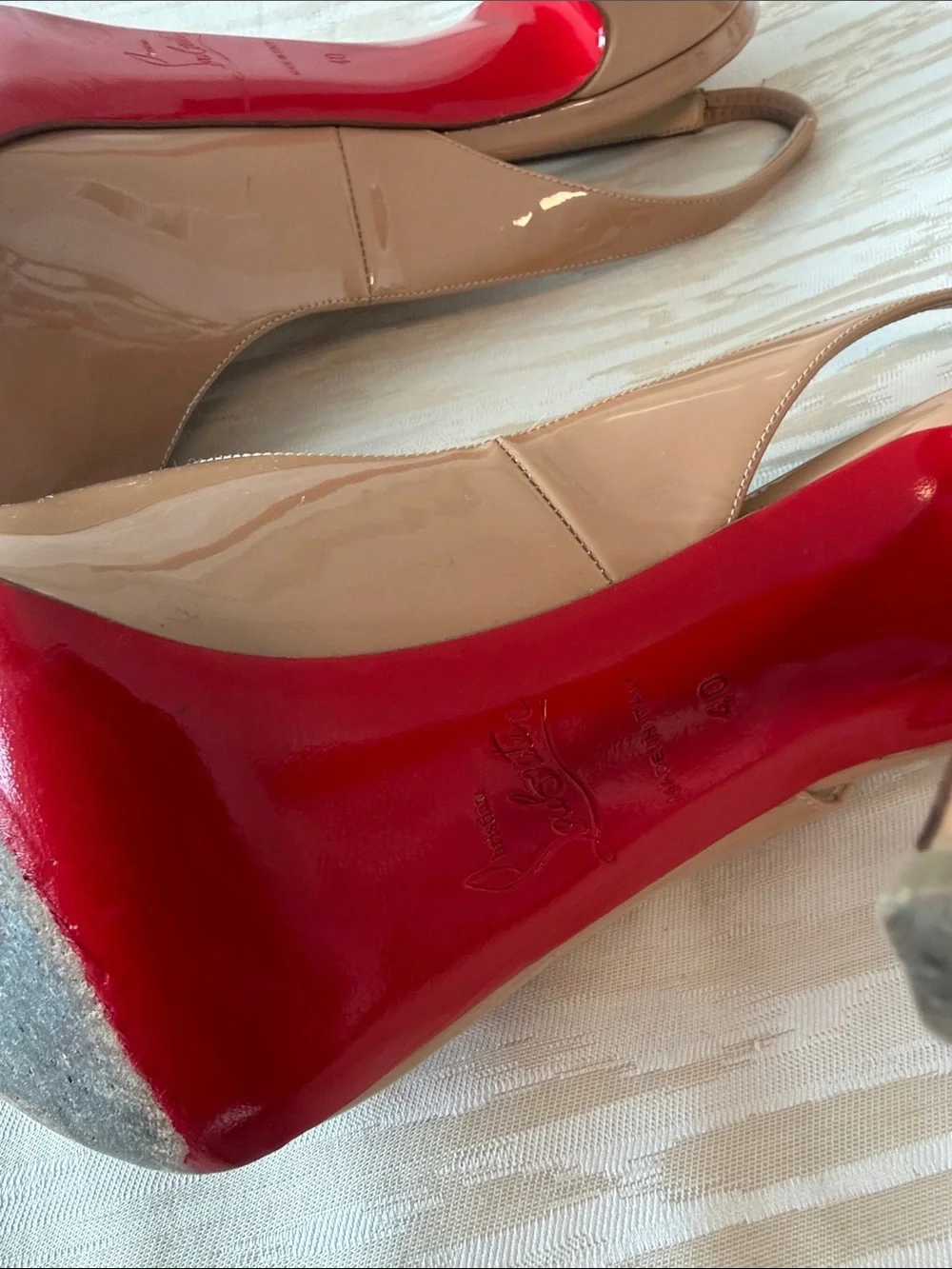 Christian Louboutin glossy beige